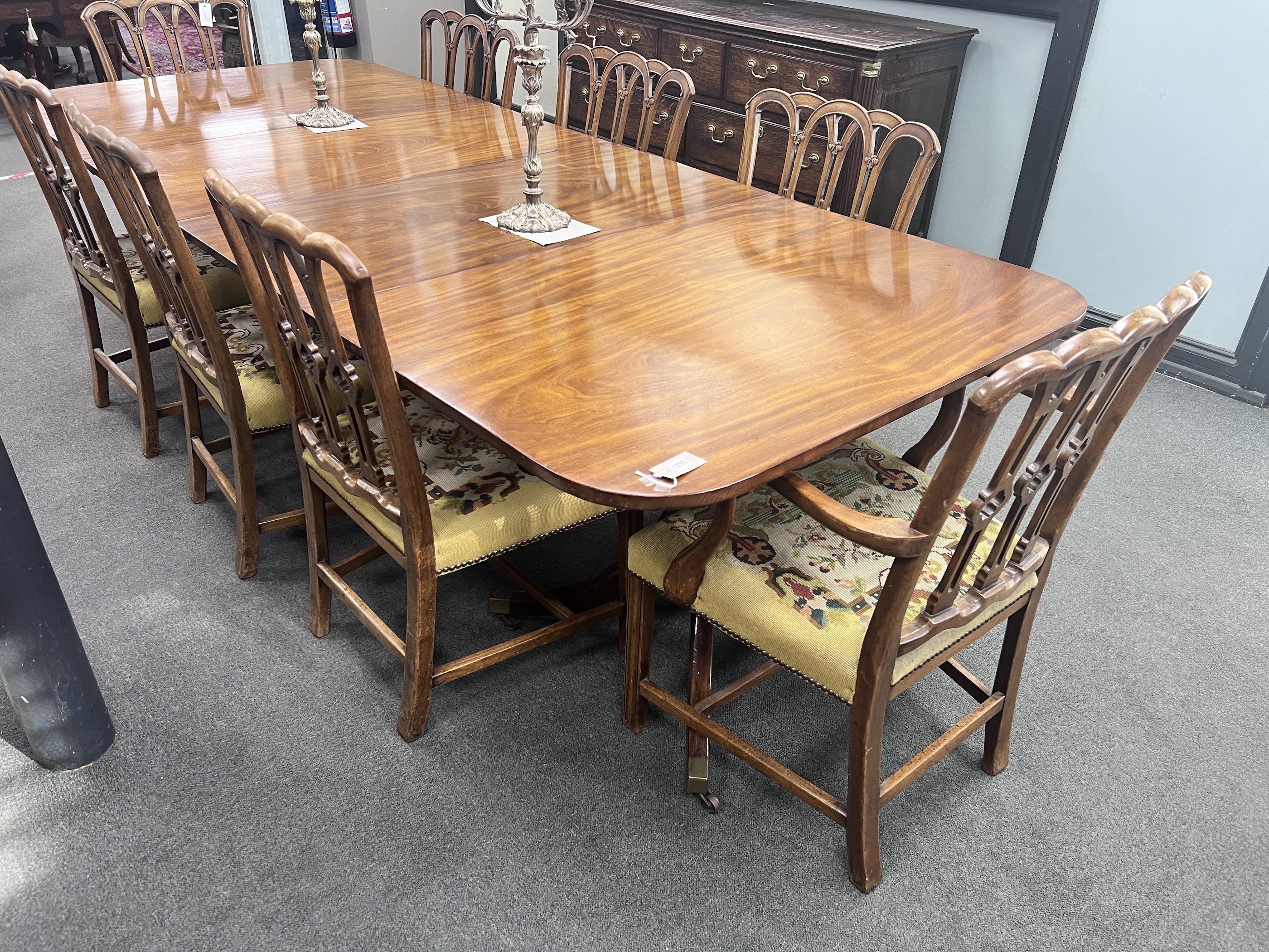 A William IV style mahogany twin pillar extending dining table, length 281cm extended, two spare leaves, width 114cm, height 75cm